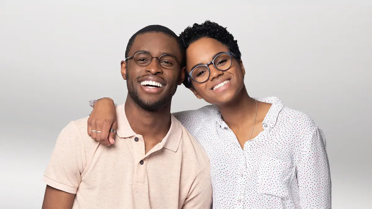 African American couple wearing glasses and smiling | Chandler Eye Care Specialists PC